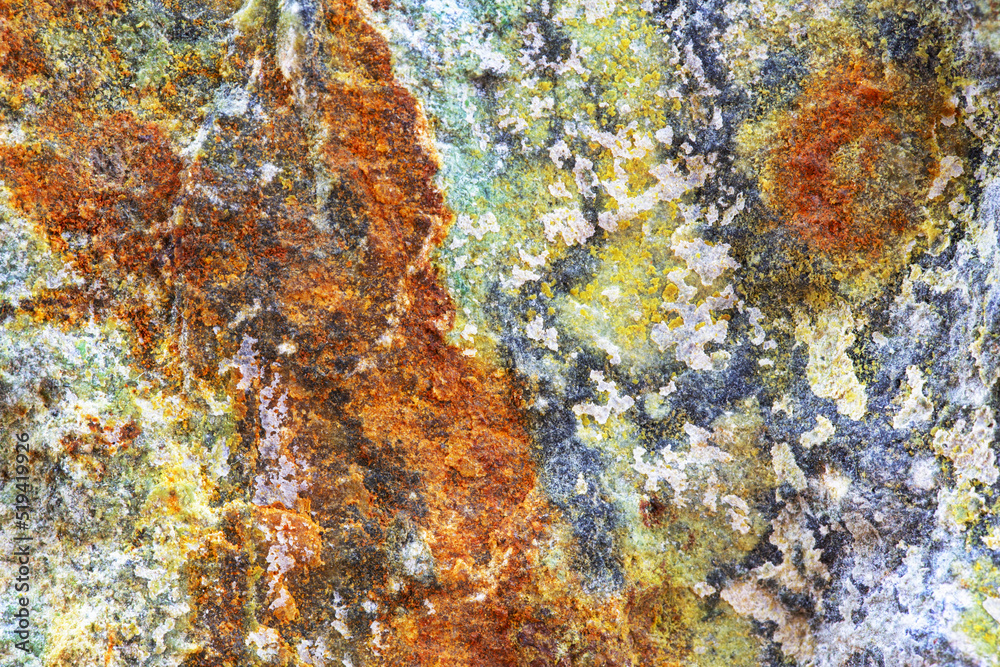 Background of red, gray, and blue veins of natural rock