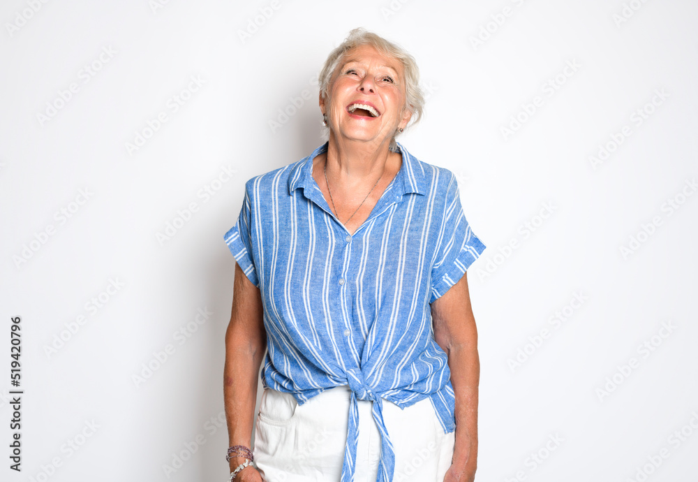 smiling retired senior woman looking at camera isolated on white background smiling retired senior woman looking at camera isolated on white background