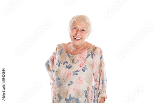 smiling retired senior woman looking at camera isolated on white background © Louis-Photo
