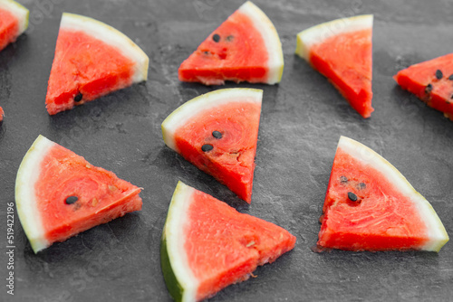 sliced fresh watermelon isolated on dark background