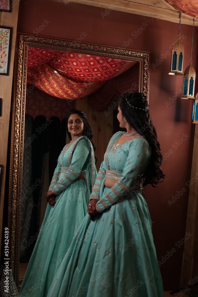 indian woman with mirror