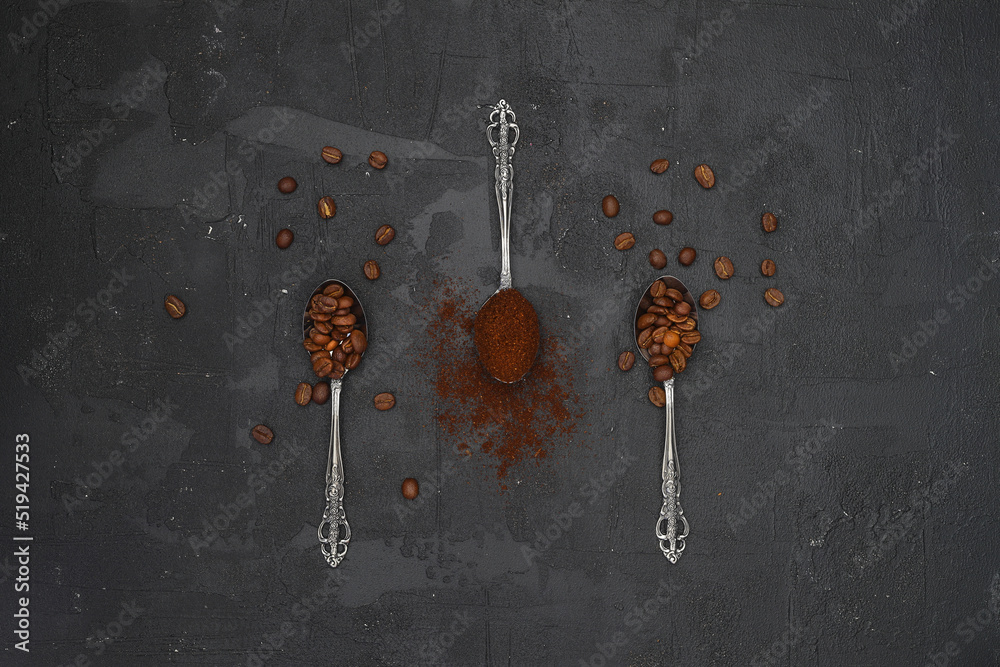 Top view of three spoons with coffee and coffee beans on black background. Flat lay composition. Top view of three spoons with coffee and coffee beans on black background. Flat lay composition.