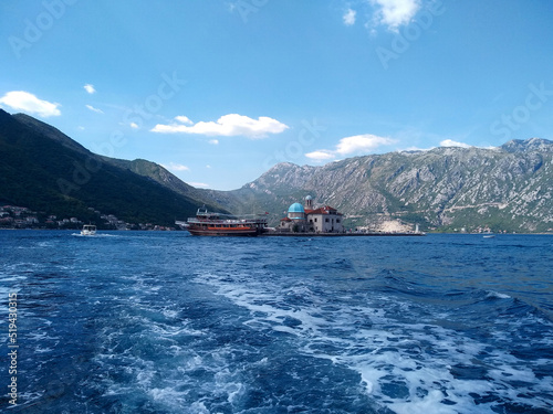 Beautiful view of the artificial island Gospa od krpjela, Our Lady of the Rocks, Roman Catholic Church, Perast, Bay of Kotor, Montenegro photo