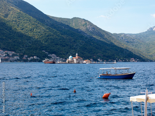 Beautiful view of the artificial island Gospa od krpjela, Our Lady of the Rocks, Roman Catholic Church, Perast, Bay of Kotor, Montenegro photo