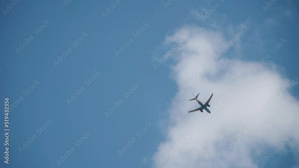 Passenger plane flying in the clouds Passenger plane flying in the clouds
