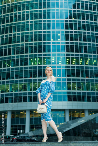 Young blonde on the background of a business center © SergeiPh