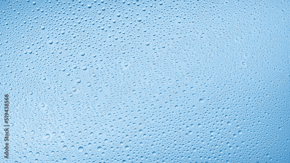 Medium size water drops on the wet glass surface on blue background | Background for skin care moisturizing products Medium size water drops on the wet glass surface on blue background | Background for skin care moisturizing products