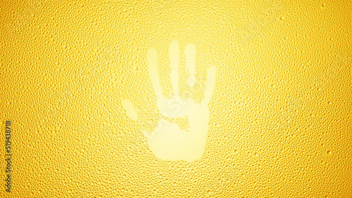 Handprint printed on the wet glass on yellow background | shower concept