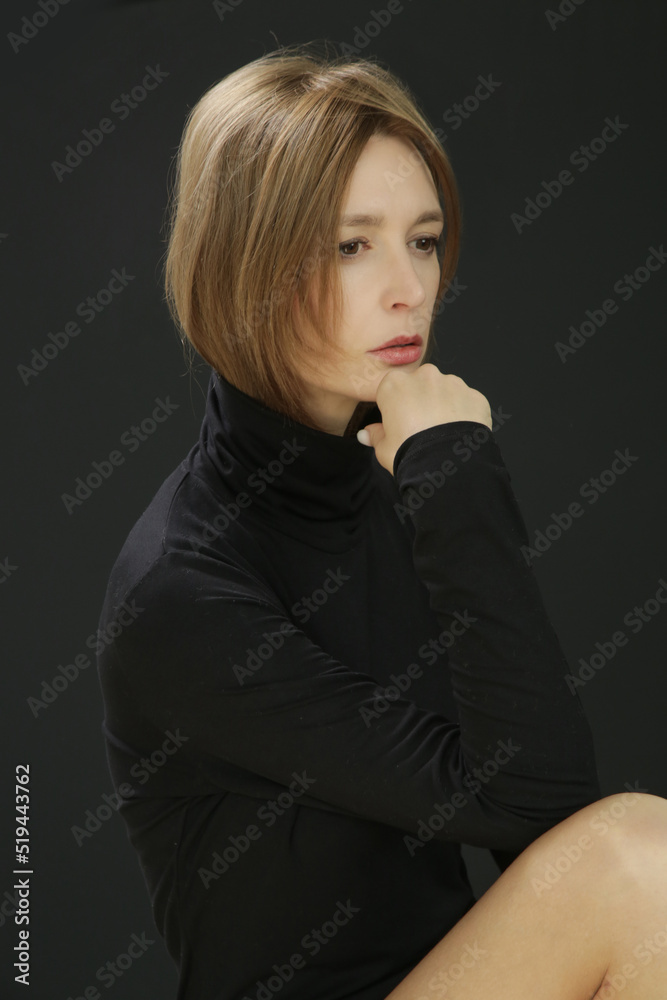 Fototapeta premium Portrait of young female model wearing black cotton turtleneck
