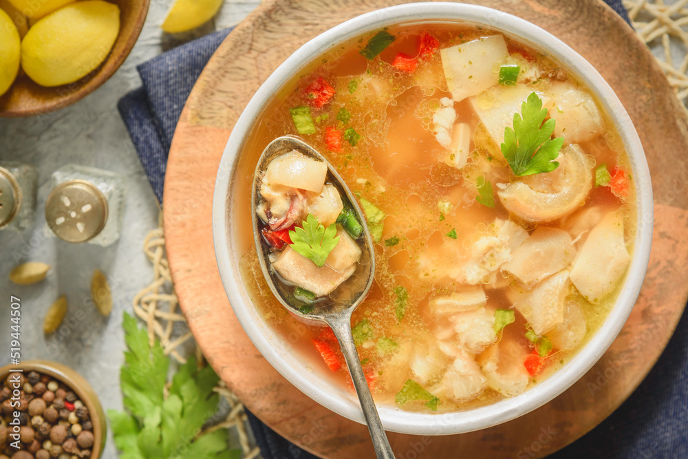 Arabic cuisine; Egyptian traditional boneless trotters soup. served with fresh lemon and black pepper. Top view with close up. Arabic cuisine; Egyptian traditional boneless trotters soup. served with fresh lemon and black pepper. Top view with close up.