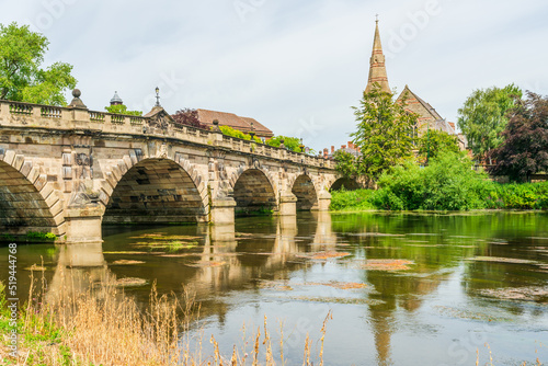 Wiew of  the Engish Bridge and United Reformed Church across the River Severn in Shrewsbury in Shropshire, UK photo