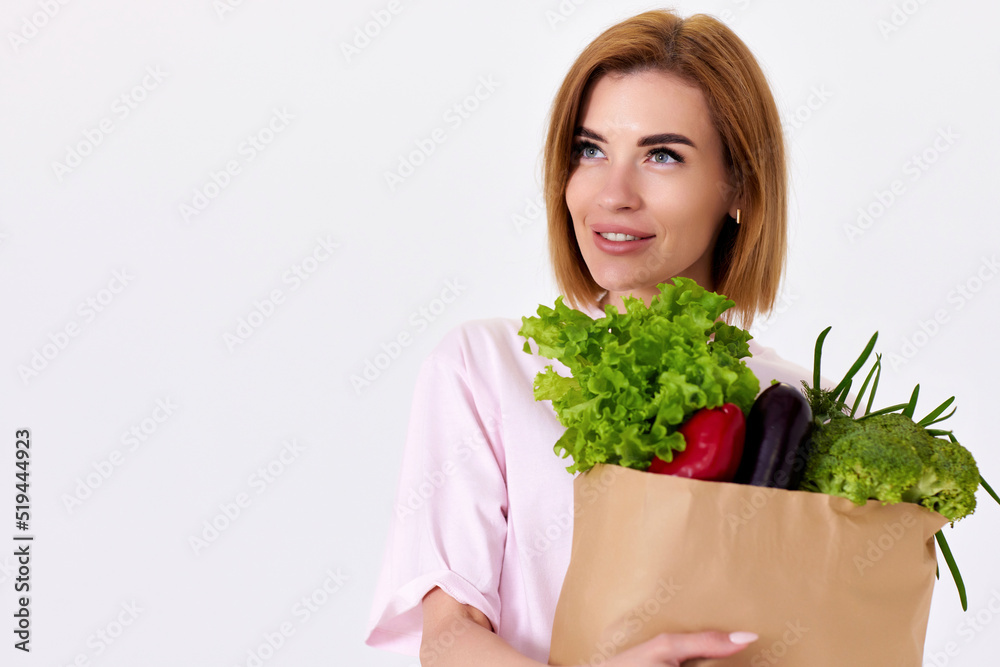 caucasian woman hold paper bag with vegetables caucasian woman hold paper bag with vegetables