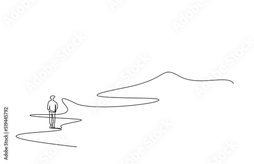 remote view of a person walking on the mountain road in nature