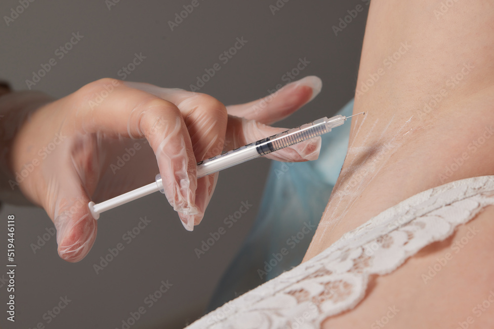 Photo & Art Print The doctor makes intramuscular injections of ...