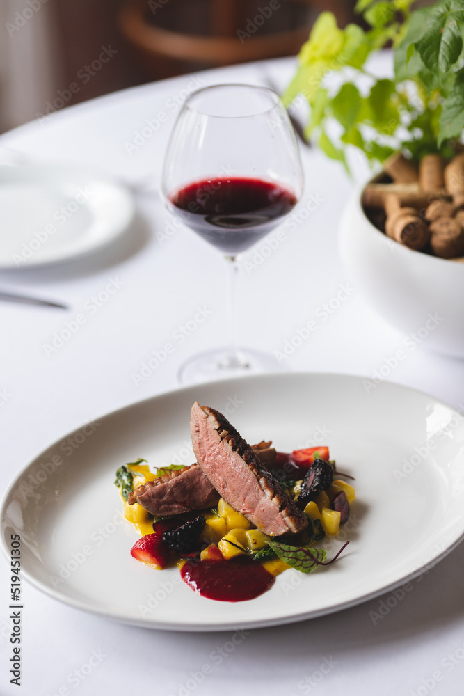 Duck breast on a substrate of fruits and vegetables, drizzled with berry sauce Duck breast on a substrate of fruits and vegetables, drizzled with berry sauce