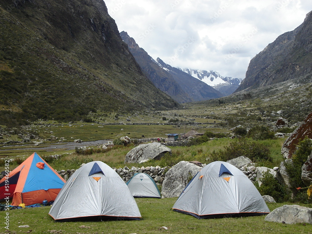 Tents wait for hikers spend the night in Cordillera blanca, Peru, after a long walk besides 6000 meters peaks