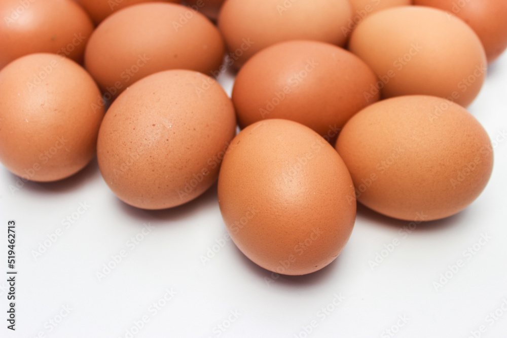 Close-Up of Fresh Raw Chicken Eggs on a White Background Close-Up of Fresh Raw Chicken Eggs on a White Background