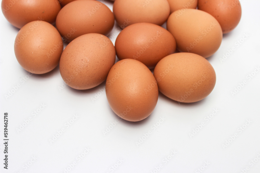 Close-Up of Fresh Raw Chicken Eggs on a White Background Close-Up of Fresh Raw Chicken Eggs on a White Background