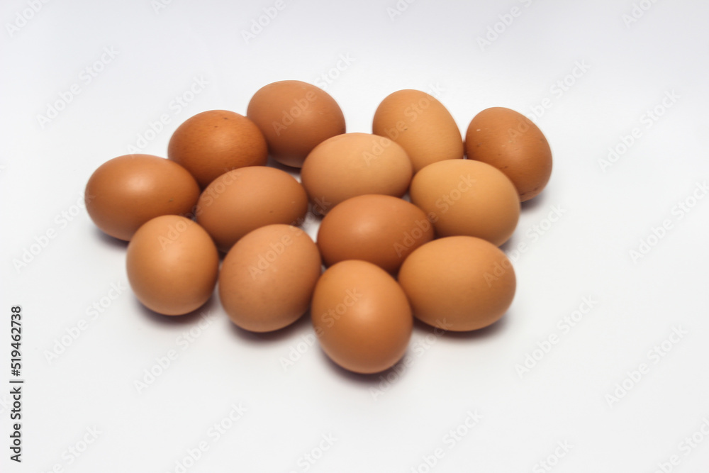Close-Up of Fresh Raw Chicken Eggs on a White Background Close-Up of Fresh Raw Chicken Eggs on a White Background