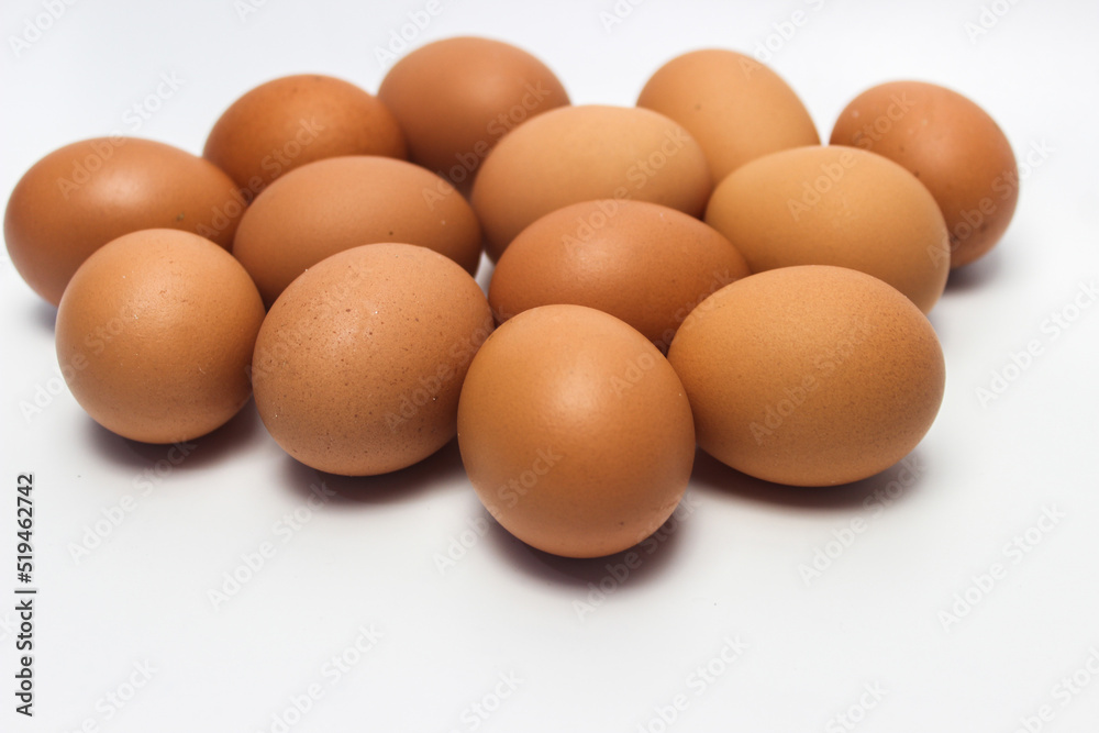 Close-Up of Fresh Raw Chicken Eggs on a White Background Close-Up of Fresh Raw Chicken Eggs on a White Background