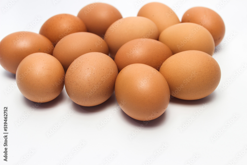 Close-Up of Fresh Raw Chicken Eggs on a White Background Close-Up of Fresh Raw Chicken Eggs on a White Background