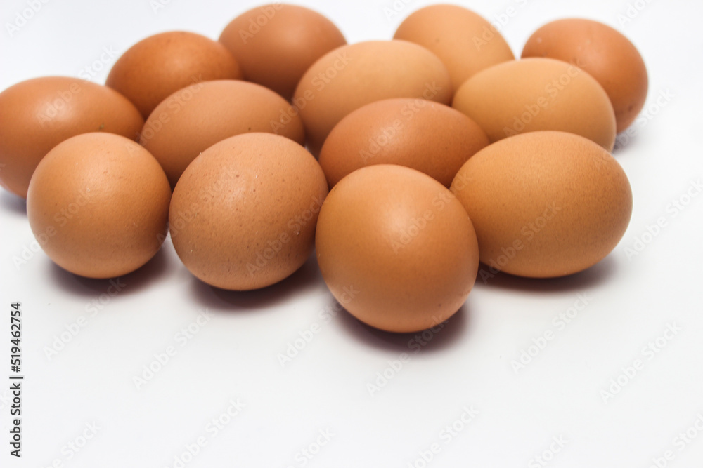 Close-Up of Fresh Raw Chicken Eggs on a White Background Close-Up of Fresh Raw Chicken Eggs on a White Background