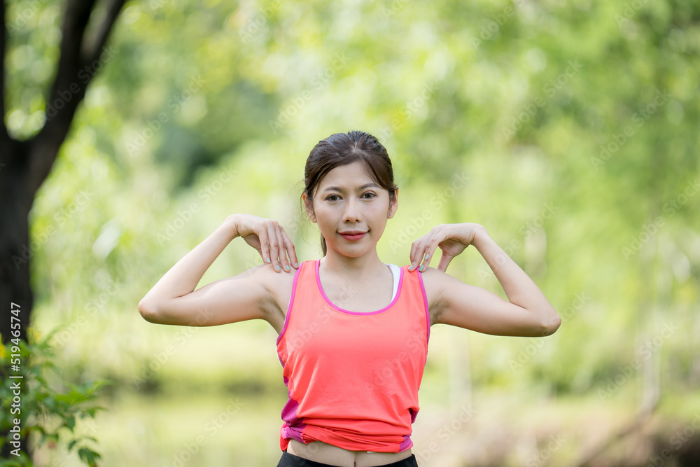 Female athlete exercising in the garden Female athlete exercising in the garden