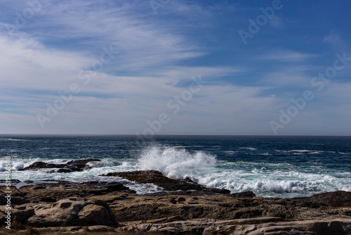 A view on Pacific ocean coast with rocks and waves
