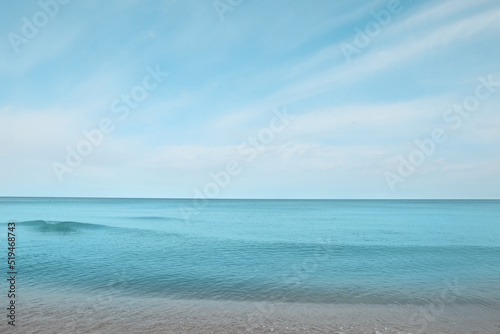 Beautiful view of sea shore under blue sky on sunny day © New Africa