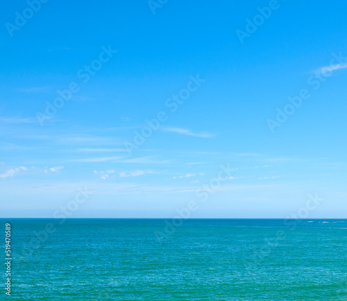 Beautiful, calm and quiet view of the beach, ocean and sea against a clear blue sky copy space background on a sunny day. Peaceful, scenic and tranquil landscape to enjoy a relaxing coastal getaway
