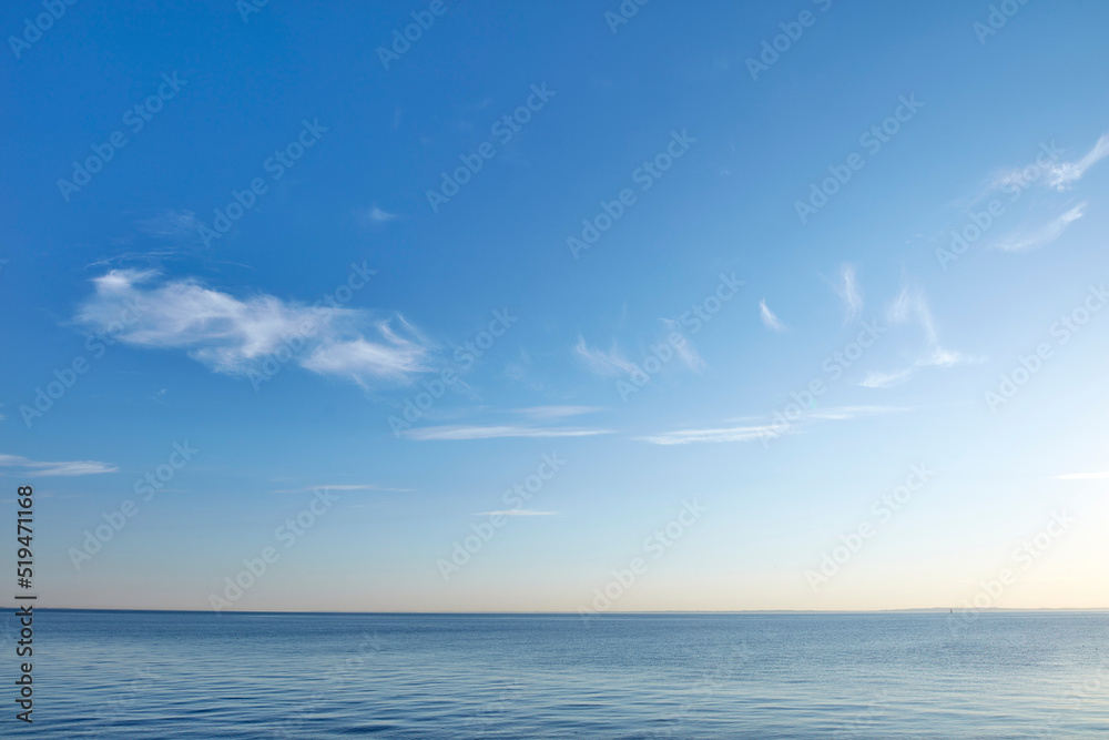Beautiful, calm and quiet view of the beach, ocean and sea against a blue sky copy space background on a sunny day outside. Peaceful, scenic and tranquil landscape to enjoy a relaxing coastal getaway