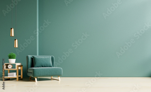 Living room with green armchair on empty dark green wall background. photo