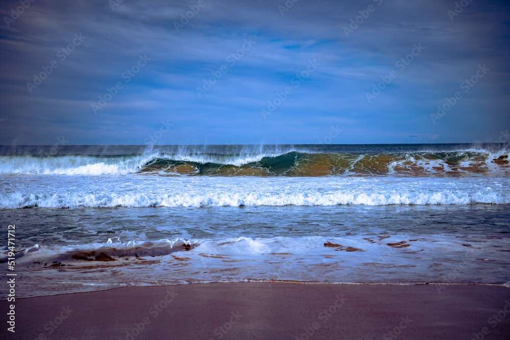 Beach waves crashing to shore