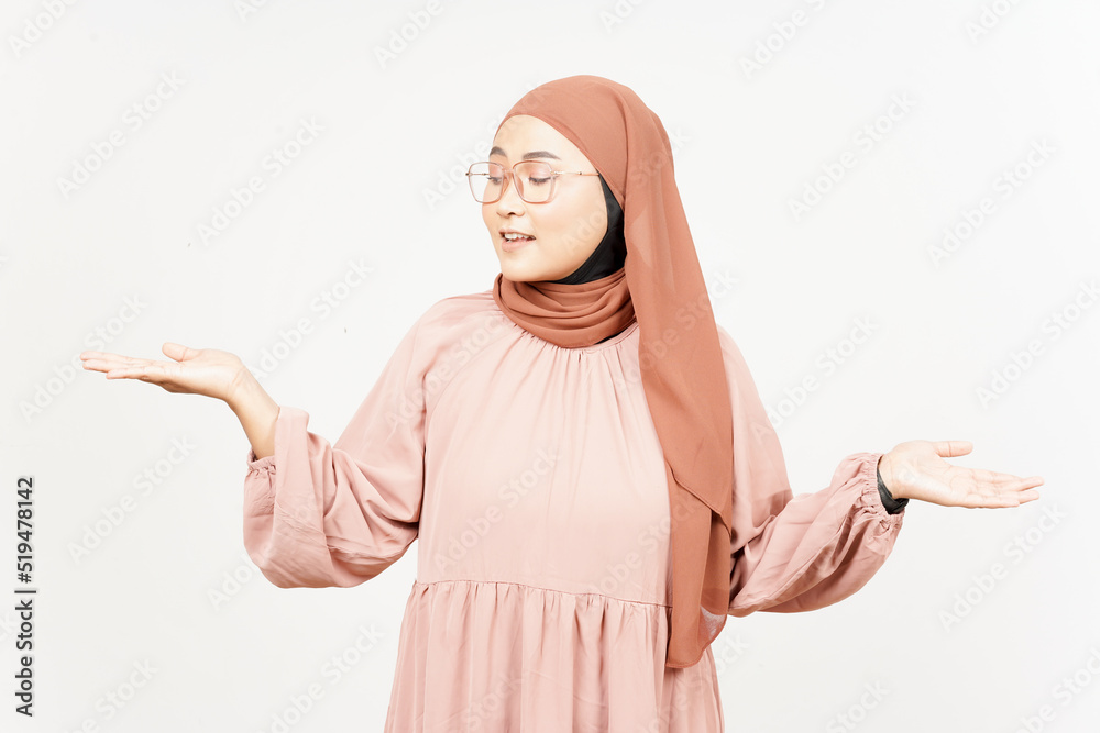 Showing and Presenting two Product on Open Palm of Beautiful Asian Woman Wearing Hijab Showing and Presenting two Product on Open Palm of Beautiful Asian Woman Wearing Hijab