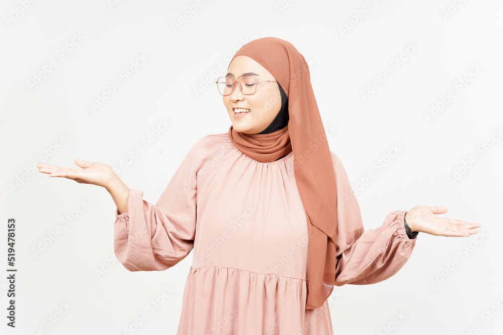 Showing and Presenting two Product on Open Palm of Beautiful Asian Woman Wearing Hijab Showing and Presenting two Product on Open Palm of Beautiful Asian Woman Wearing Hijab