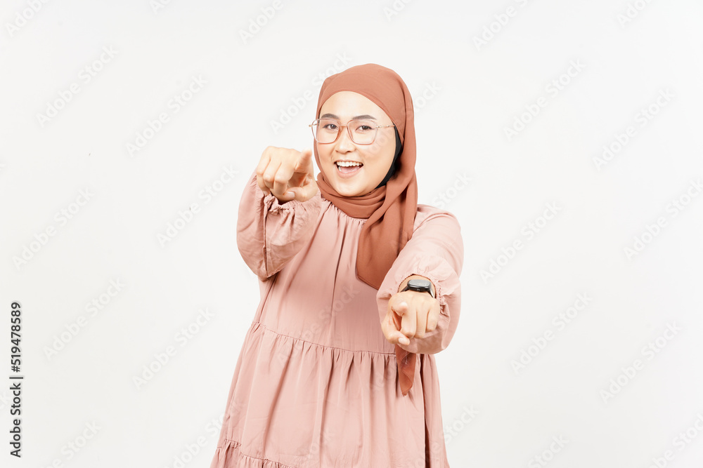Smiling and pointing at you of Beautiful Asian Woman Wearing Hijab Isolated On White Background Smiling and pointing at you of Beautiful Asian Woman Wearing Hijab Isolated On White Background