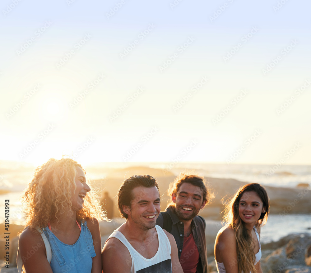 group of friends on beach enjoying summer holiday students having fun vacation hanging out on beachfront at sunset group of friends on beach enjoying summer holiday students having fun vacation hanging out on beachfront at sunset