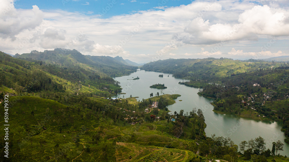 Aerial drone of Hills with tea plantations around the lake in the mountains. Maskeliya, Castlereigh, Sri Lanka.