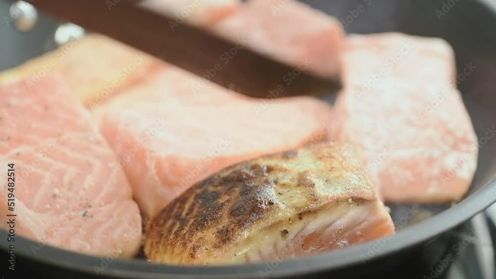 Preparation and turning of salmon in a frying pan.
Preparation and turning of salmon in a frying pan.