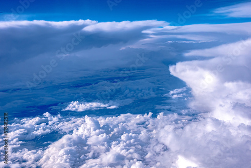 Fototapeta Naklejka Na Ścianę i Meble -  View of blue cloudy sky from airplane window