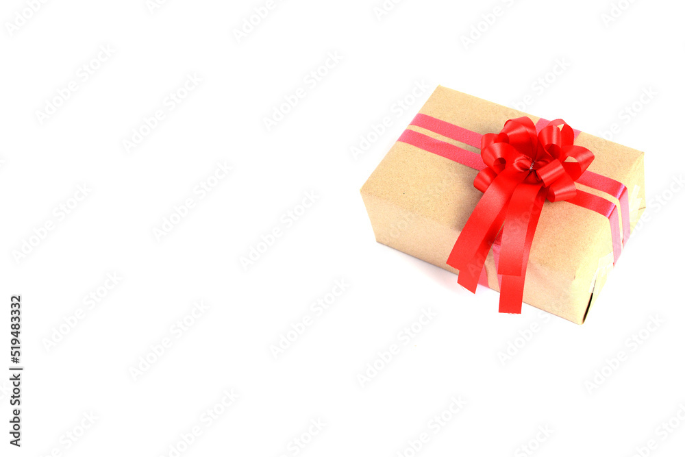 Fototapeta premium Brown craft gift box with red ribbon bow isolated on white background.