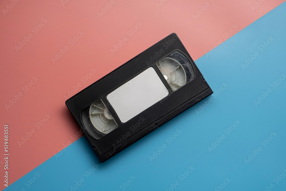 Old video tape on colorful background. VHS video tape. Retro, vintage concept. Old video tape on colorful background. VHS video tape. Retro, vintage concept.