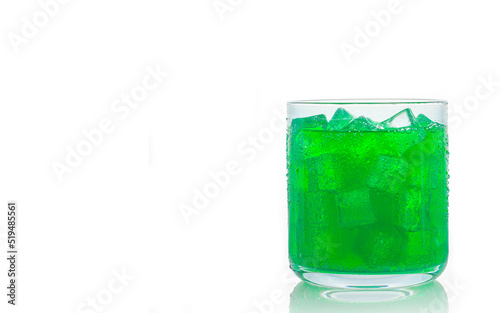 A glass of lime green soft drink isolate on white Background