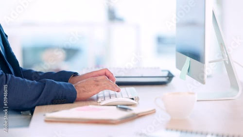 Mans hands typing on computer keyboard in his office desk at work close up. Operations Research Analyst sending feedback on creative data mining methods via email to help the business reduce costs photo