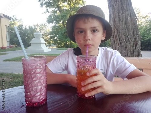 Child drinking lemonade 