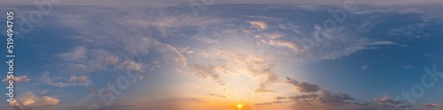 Golden glowing sunset sky panorama with Cirrus clouds. Hdr seamless spherical equirectangular 360 panorama. Sky dome or zenith for 3D visualization and sky replacement for aerial drone 360 panoramas.