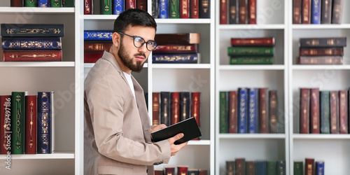 Handsome student choosing b...