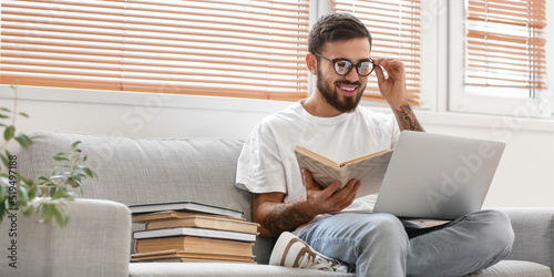 Male student with laptop an...