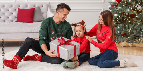 Parents giving Christmas pr...
