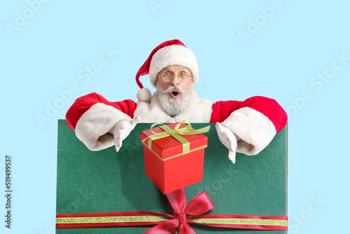 Portrait of surprised Santa...